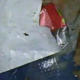 Cropped photo of a crushed blue bottle